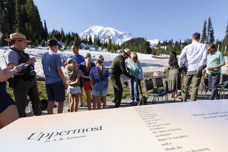 Poetry in Parks: Visitors Gathering Around the Poem Table